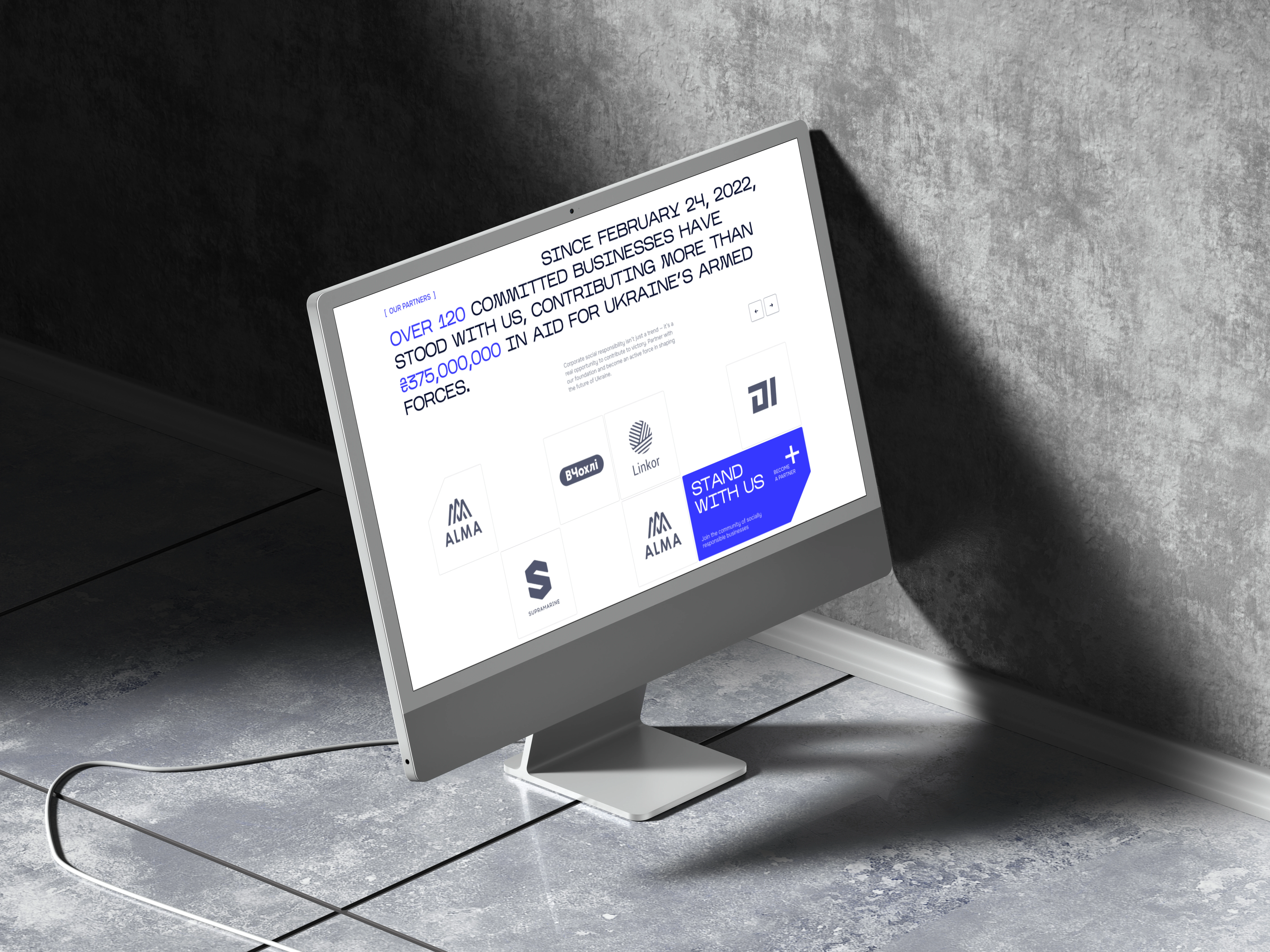 iMac mockup showing Wave'91 Stand With Us partners page